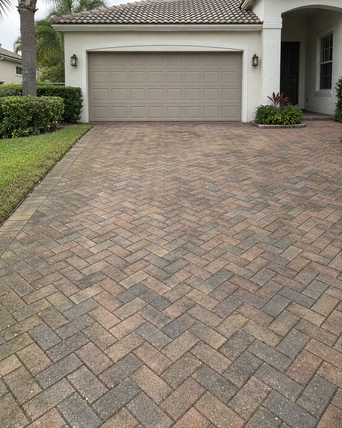 Illustration of a weathered paver driveway before cleaning