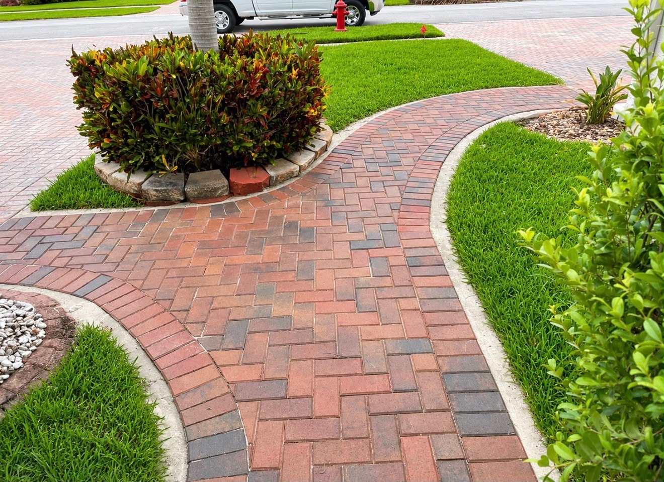 Paver walkway at a landscaped residential property